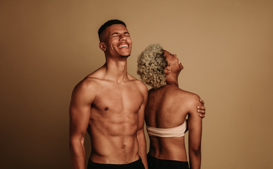 fit and confident couple laughing in a studio showing off their brown skin.jpg s=1024x1024&w=is&k=20&c=kzFV7ab5wnC OosbdebeALPdzogFJR sfp1dbQ2OkjY=