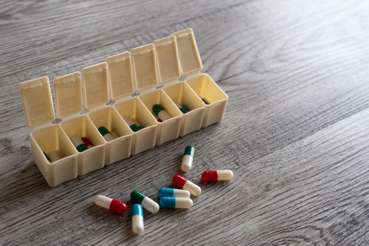 closeup image of colorful medicine pills and pillbox organizer on table.jpg s=1024x1024&w=is&k=20&c=3kb8K6bPKrxy sRjdOmh78vmFGgvP6nTJD1Sj9D8WEg=